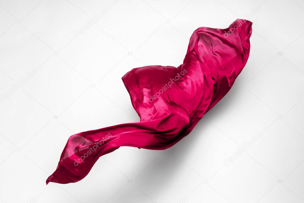 abstract piece of red fabric flying, high-speed studio shot