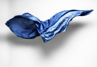 soyut mavi kumaş parçası uçan, yüksek hızlı stüdyo çekimi