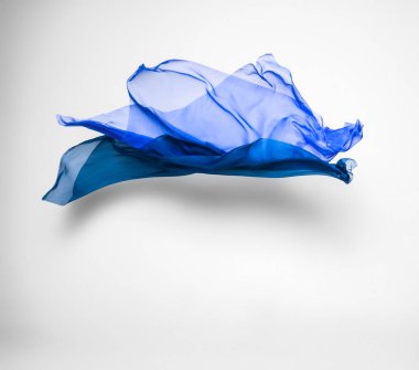 soyut mavi kumaş parçası uçan, yüksek hızlı stüdyo çekimi