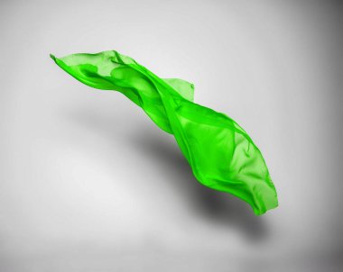 Soyut yeşil kumaş parçası uçan, yüksek hızlı stüdyo çekimi