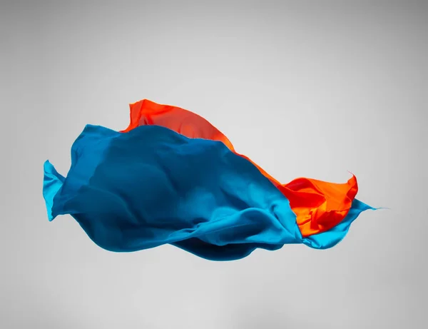 abstract pieces of multicolored fabric flying, high-speed studio shot