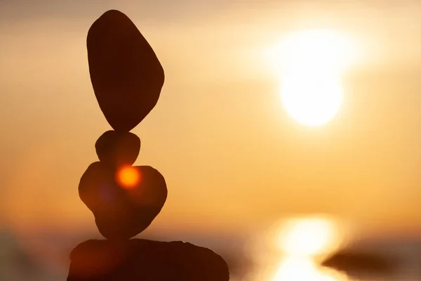 balanced stones on the beach