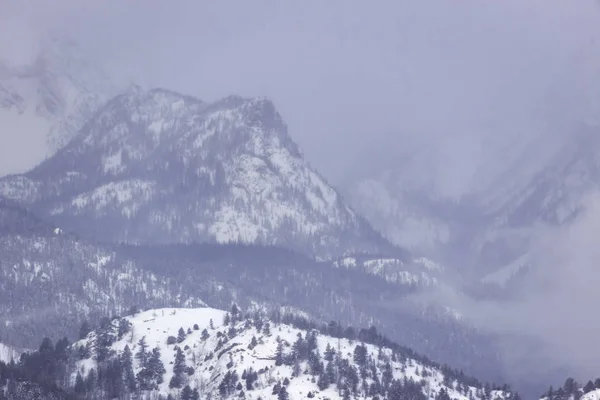 Snow Storm Rolling Over Mountain Peaks in Rocky Mountain Nationa