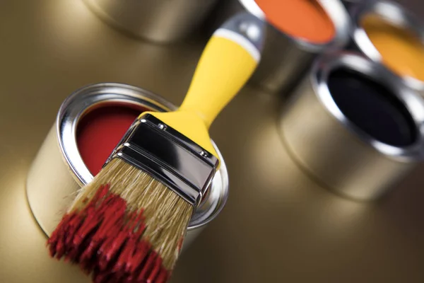 Metal tin cans with color paint and paintbrush