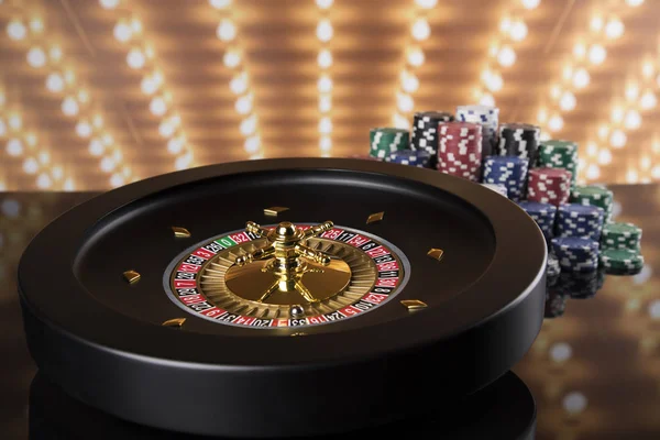 Poker Chips on gaming table, roulette wheel in motion, casino background