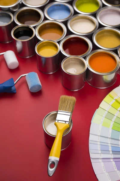 Full Buckets Rainbow Colored Oil Paint Red Background — Stock Photo, Image