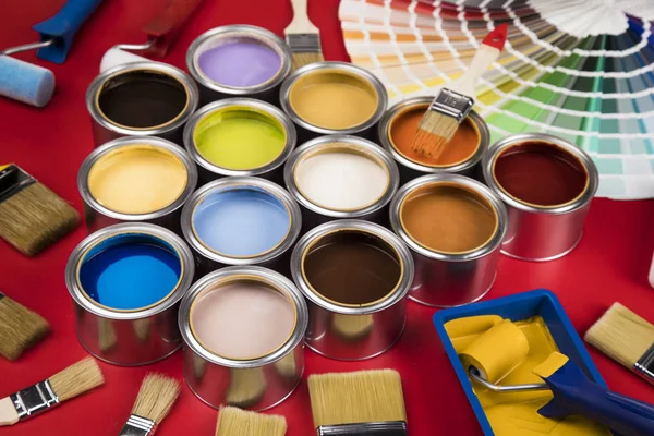 Full Buckets Rainbow Colored Oil Paint Red Background — Stock Photo, Image