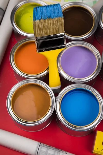 Full Buckets Rainbow Colored Oil Paint Red Background — Stock Photo, Image