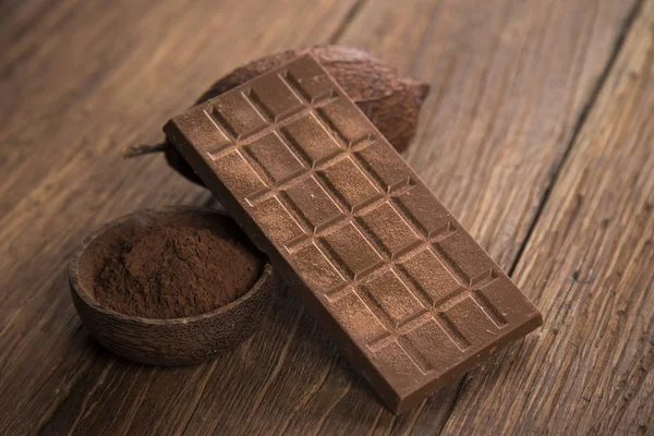 Leche Chocolate Negro Sobre Fondo Papel Natural — Foto de Stock