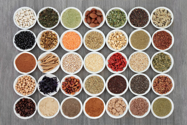 Dried diet health food with supplement powders, legumes, nuts, seeds, grains, cereals, vegetables, fruit, and herbs with some being used as appetite suppressants. 