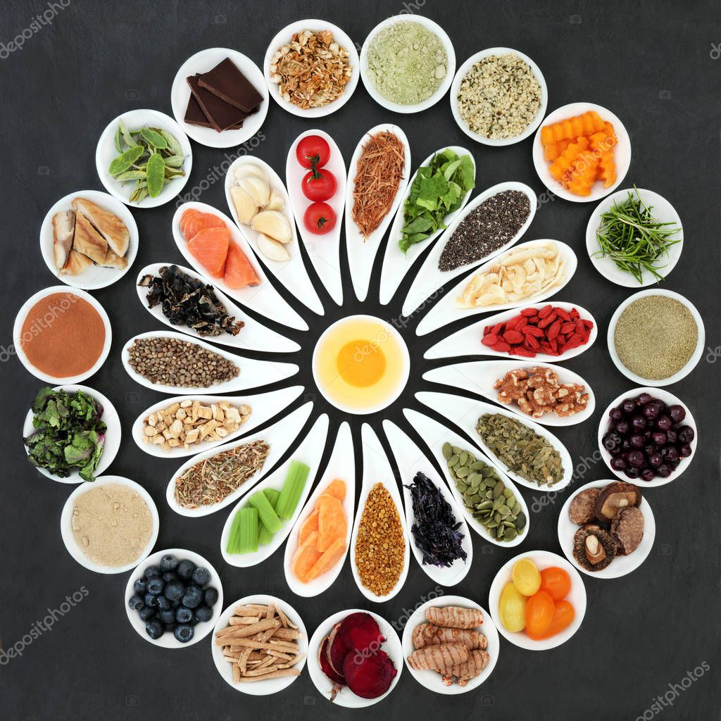 Health food to boost brain power in porcelain dishes on slate background. Super food concept  high in omega 3 fatty acids, antioxidants, vitamins, minerals and anthocyanins. Top View 