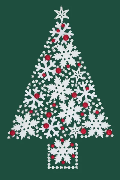 緑の背景に雪の結晶と赤の安物の宝石装飾のクリスマス ツリーの概要です ホリデー シーズンのお祝いグリーティング カード — ストック写真