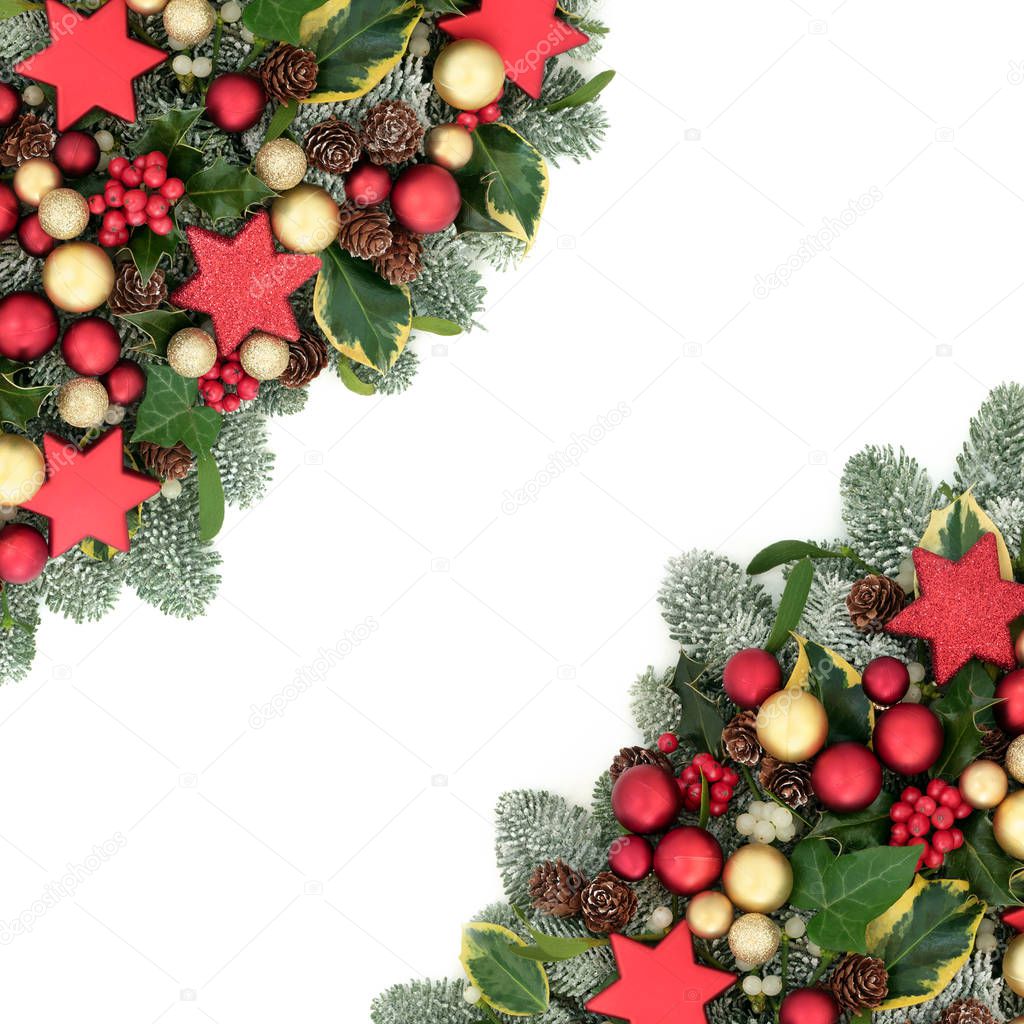 Christmas festive background border with red and gold bauble decorations, holly berries, spruce pine, ivy, pine cones and mistletoe on white with copy space.