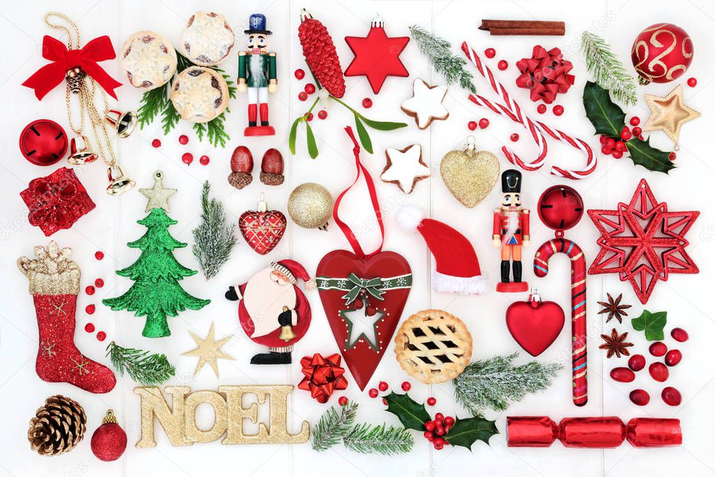 Christmas background with noel sign, retro and new bauble decorations, candy canes, mince pies, winter flora,  ribbons and bows on rustic white wood. Top view.