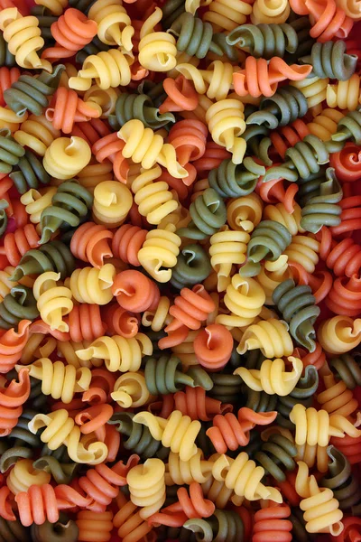 Trottole Tricolore Pasta Vormen Een Abstracte Achtergrond — Stockfoto