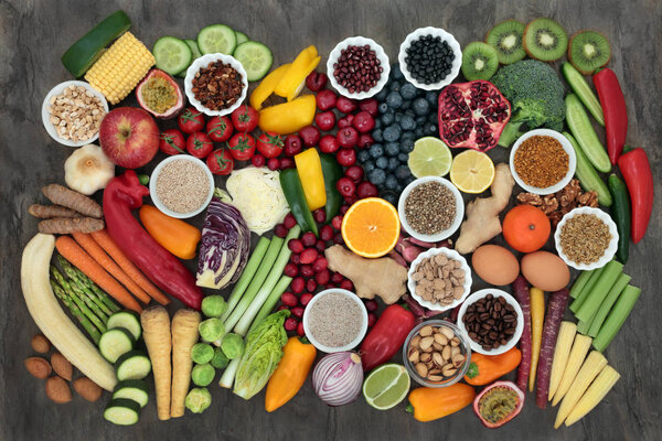 Large super health food collection with fresh fruit, vegetables, seeds, grains, dairy, coffee, nuts, legumes, grains, herbs and spices. High in antioxidants, protein, anthocyanins, vitamins and dietary fibre.