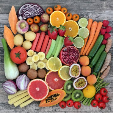 Diet super food selection with fresh vegetables and fruit with health food high in dietary fibre, antioxidants, vitamins and minerals. Top view on rustic wood background. clipart
