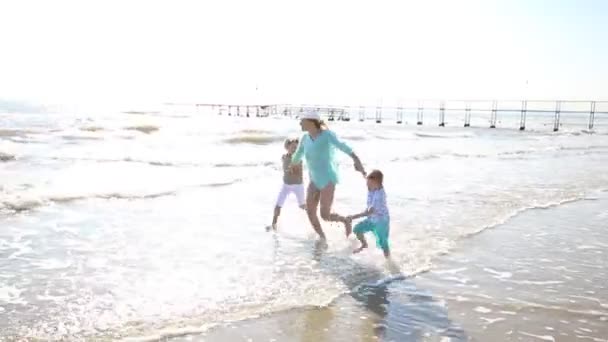 Happy Mom Playing Whit Her Children Sea — Stock Video