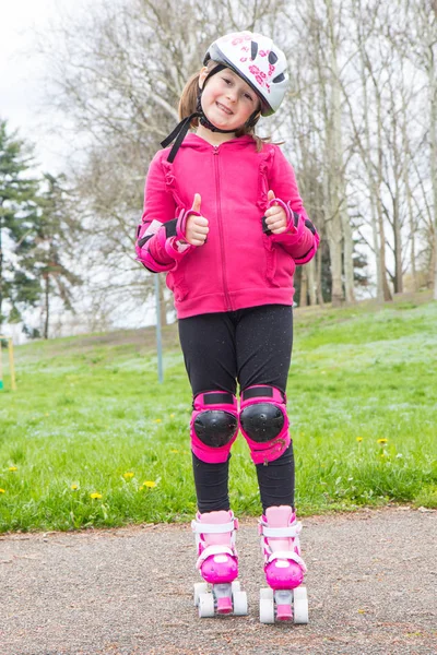 young girl with roller skates in the park