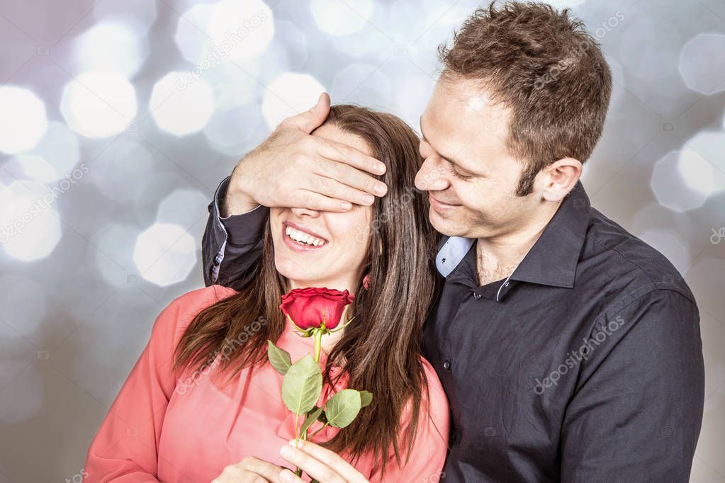 Valentine's day : man in love gives a rose to his beloved 
