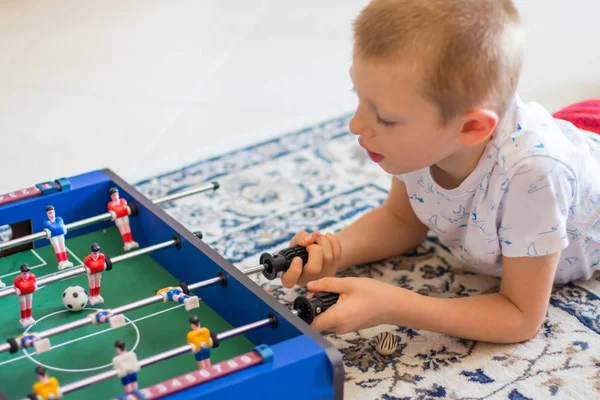 Little boy playing with foosball — Stock Photo, Image