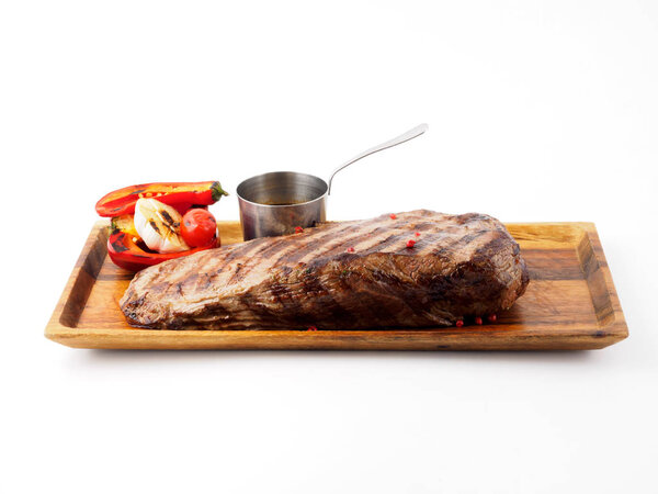 Restaurant dish. A piece of beef and vegetables cooked on the grill.