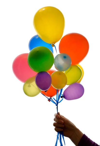 Woman hand holding balloons — Stock Photo, Image