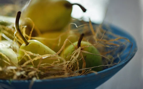 Pears in blue basket — Stock Photo, Image