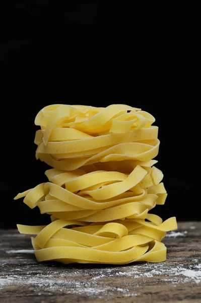 Raw Tagliatelle Pasta Black Background — Stock Photo, Image