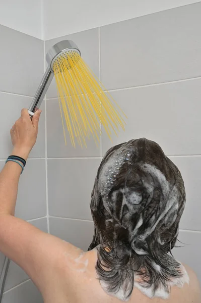 Abstract Girl Stands Silver Shower Long Pasta Spaghetti Water Jet — Stock Photo, Image