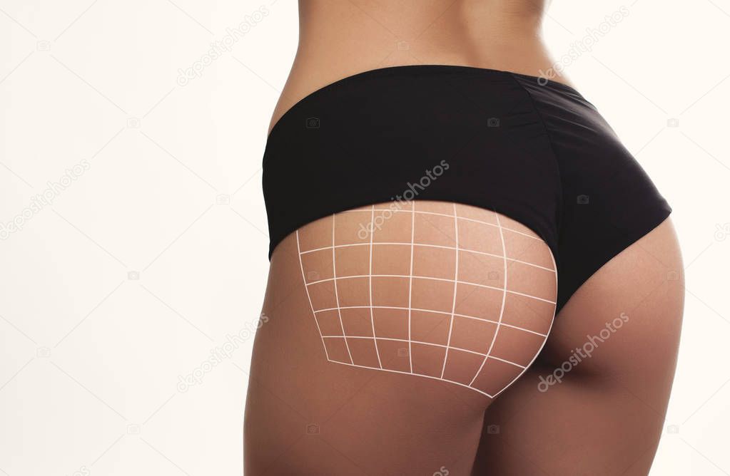 closeup woman beautiful buttocks with grid over white background