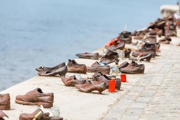 Iron shoes memorial to Jewish people executed while Holocaust in Budapest Hungary at Danube river bank