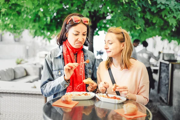 Two Girl Friends Students Trying Sausage Grimace Disgust Face Concept — Stock Photo, Image