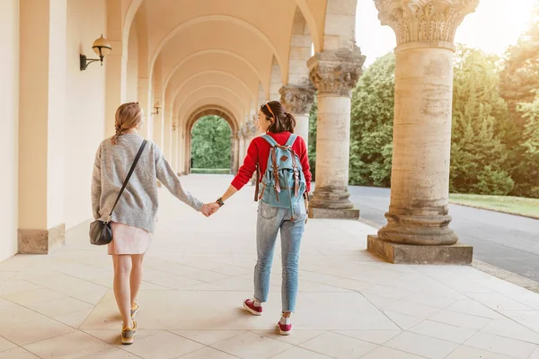 Tourists couple travel in old medieval monastery