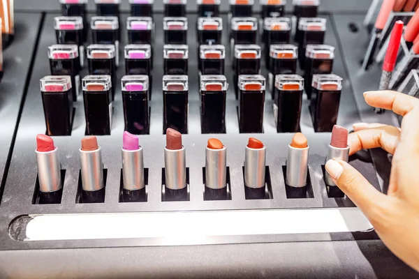 Woman Chooses Lipstick Cosmetic Store — Stock Photo, Image