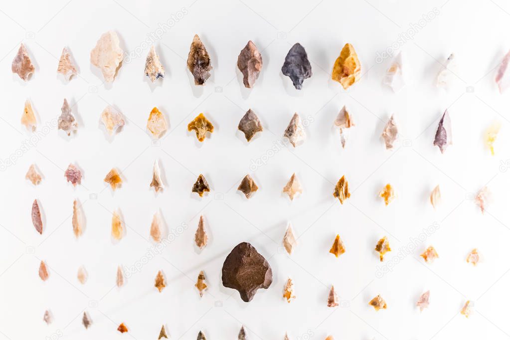 Stone arrowheads as primitive weapon and tools, archeology concept