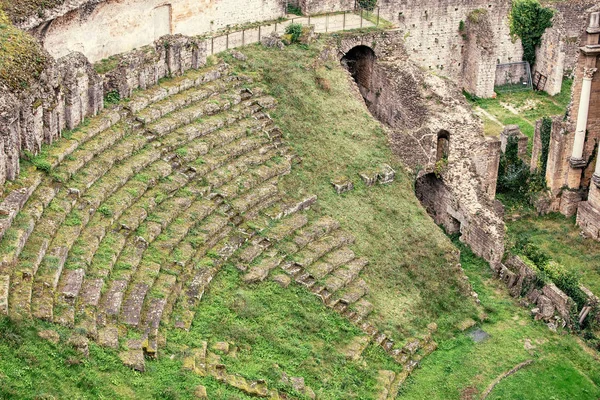 Aerial view of the old ruins of an ancient Roman amphitheater in Volterra, Italy