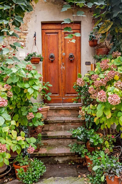 Decorated with flowers Porch in small town in Italy