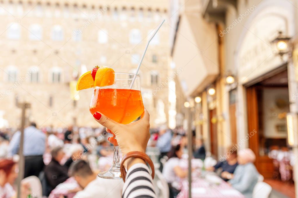 Aperol spritz cocktail decorated with orange and strawberry