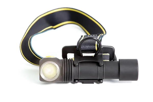 Head lamp flashlight with light beam studio shot