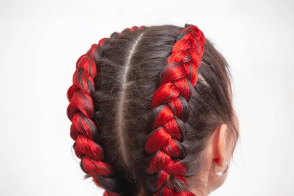 Braided hairstyle with red hair extensions on a white background — Stock Photo, Image