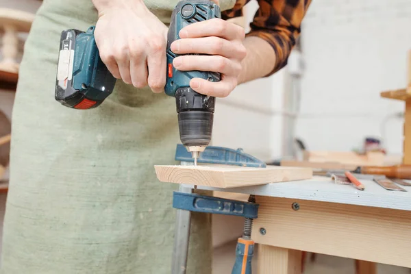 Worker man with screwdriver drill in carpentry. Handyman skills — Stock Photo, Image