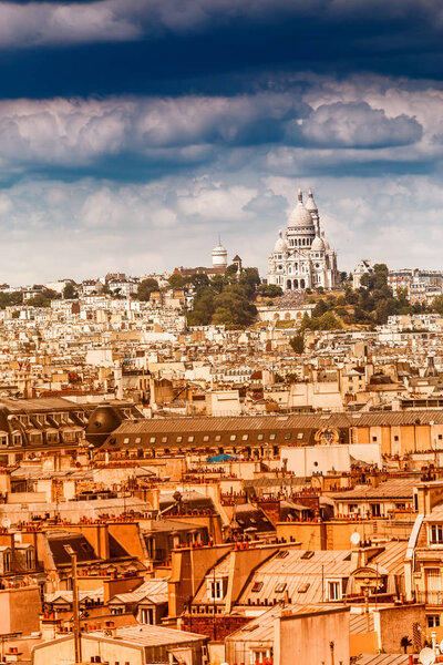 Aerial View on Montmartre Hill and Sacre-Coeur Church. Urban Paris city skyline at hot summer