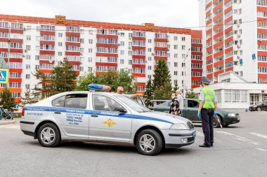 24 May 2020, Ufa, Russia: Road police car and inspector checking drivers license clipart