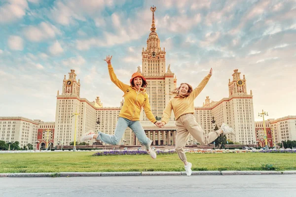 Two Female Friends Happy Enter Pass Entrance Tests University Jump — Stock Photo, Image