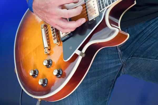 Closeup Rock Musician Strumming Electric Guitar — Stock Photo, Image