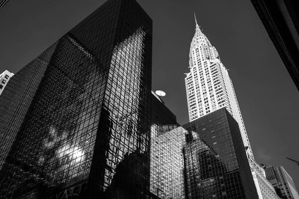 NEW YORK, USA - Jun 01, 2014: Black and white image of Chrysler building and manhattan modern architecture. Manhattan is the most densely populated of the five boroughs of New York City