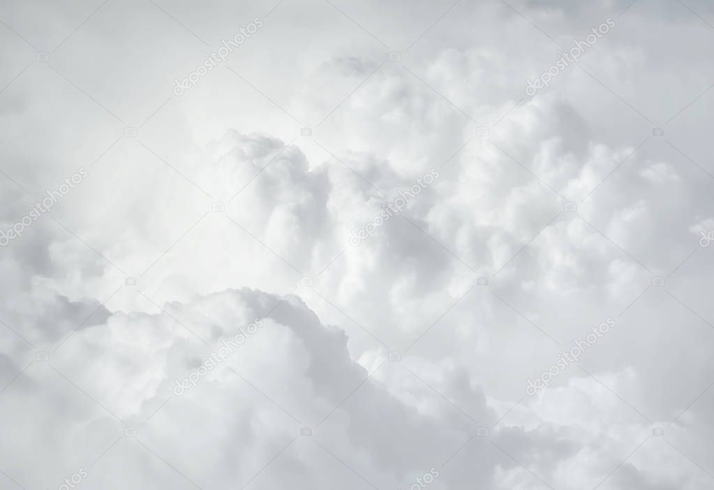 Sky with clouds, a view from an aeroplane above the clouds. Abstract nature background with clouds in light tonality. White cumulus clouds