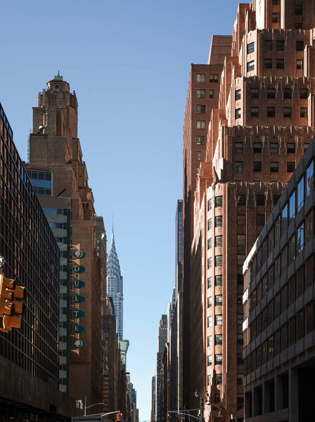 New York, USA - Sep 23, 2017: Manhattan street scene. Chrysler building and manhattan modern architecture. Manhattan is the most densely populated of the five boroughs of NYC