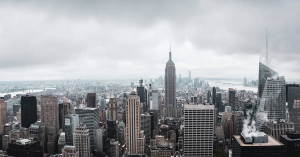 NEW YORK, USA - May 03, 2016: Streets and roofs of Manhattan on a cloudy day. New York City skyline. Birds eye view of Manhattan. Manhattan is the most densely populated of the five boroughs of NYC